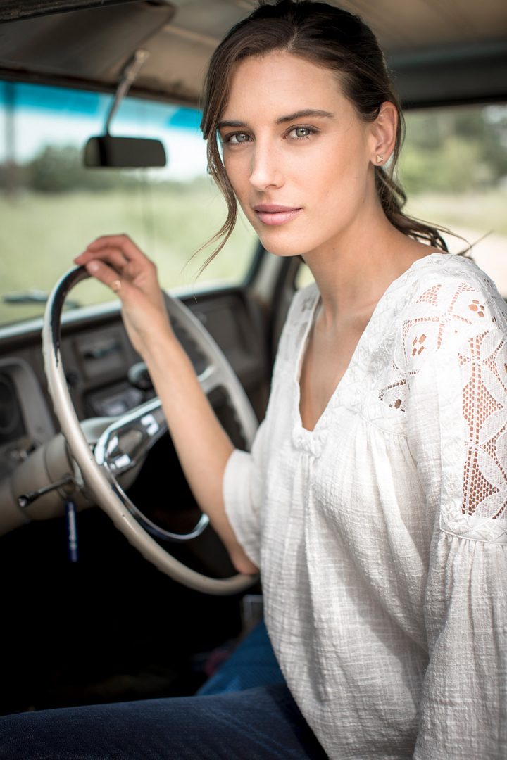 Woman Driving Classic Pickup Truck For Western Fashion Shoot with Wrangler