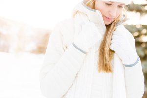 Woman In The Snow In Colorado Wearing Smartwool Jacket For Lifestyle Shoot