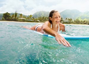 Woman Female Athlete Surfing In Hawaii
