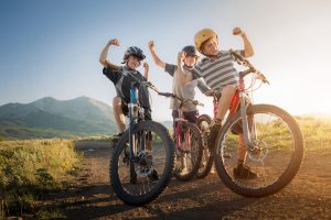 Three Boys are Proud and Excited about their Mountain Biking run Near Carbondale, Colorado. This Photo was Part of an Ad Campaign for Smartwool.