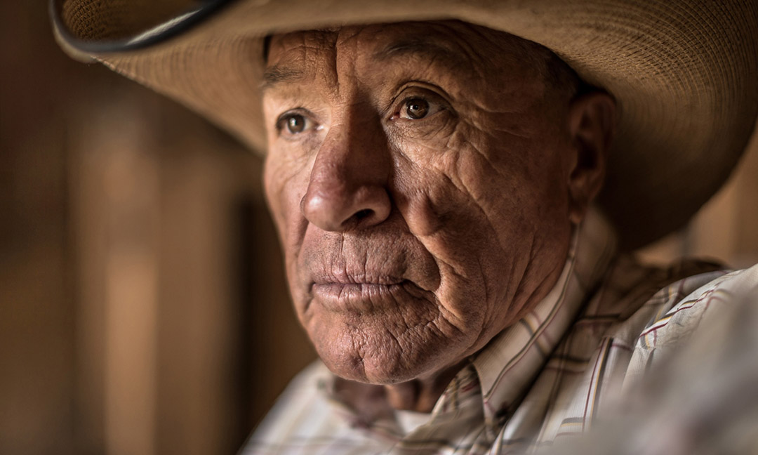 An Old Rancher Looks Out The Window.