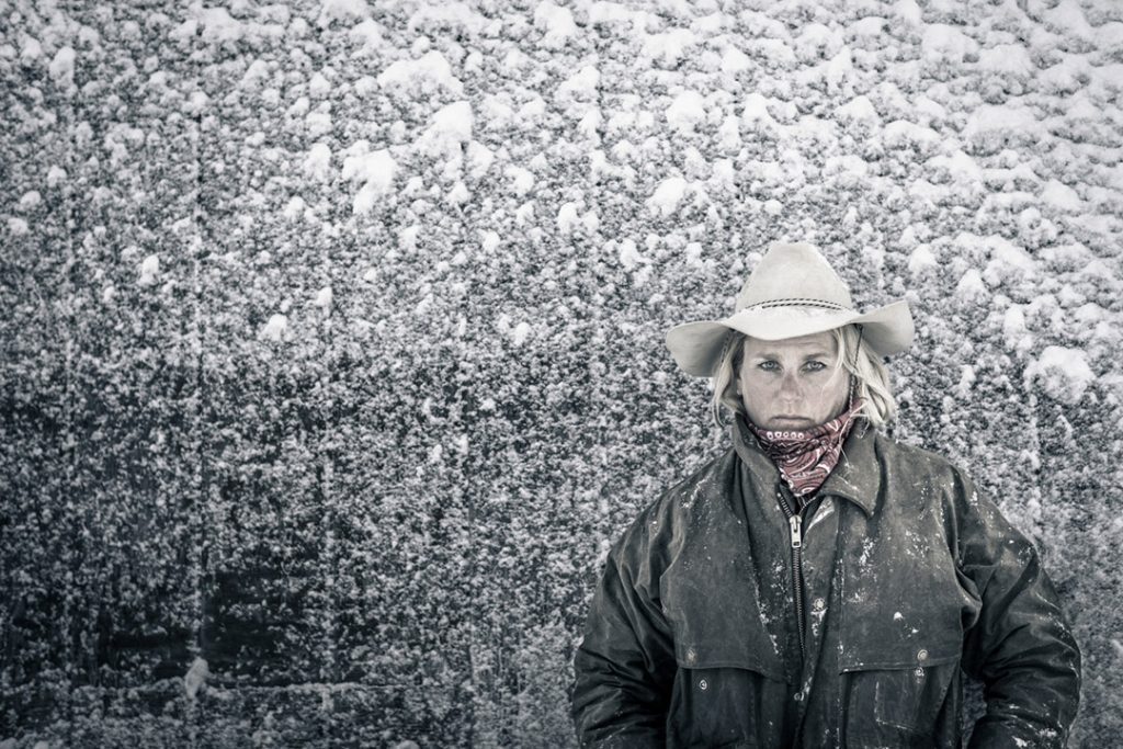 Female Rancher In The Snow On A Cold Day