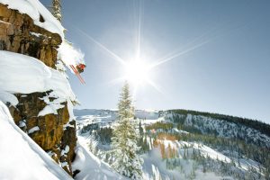 John Nicoletta and Kate Olson skiing powder and jumping cliffs at Snowmass, Aspen/Snowmass, Colorado. Local Adventure Photographer Captures Locals at Play.