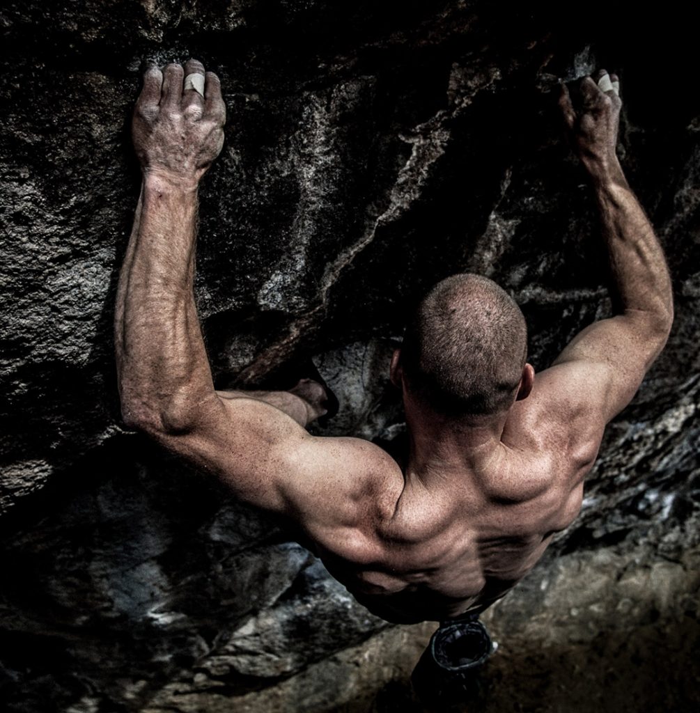 Extreme Rock Climber Climbs A Difficult Pitch In Colorado. Bouldering and Free Solo Images.