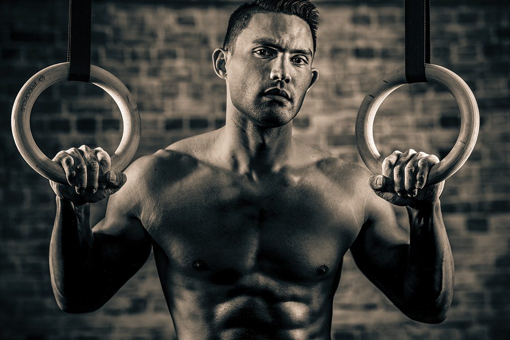 man poses for portrait during crossfit (cross fit) practice. 