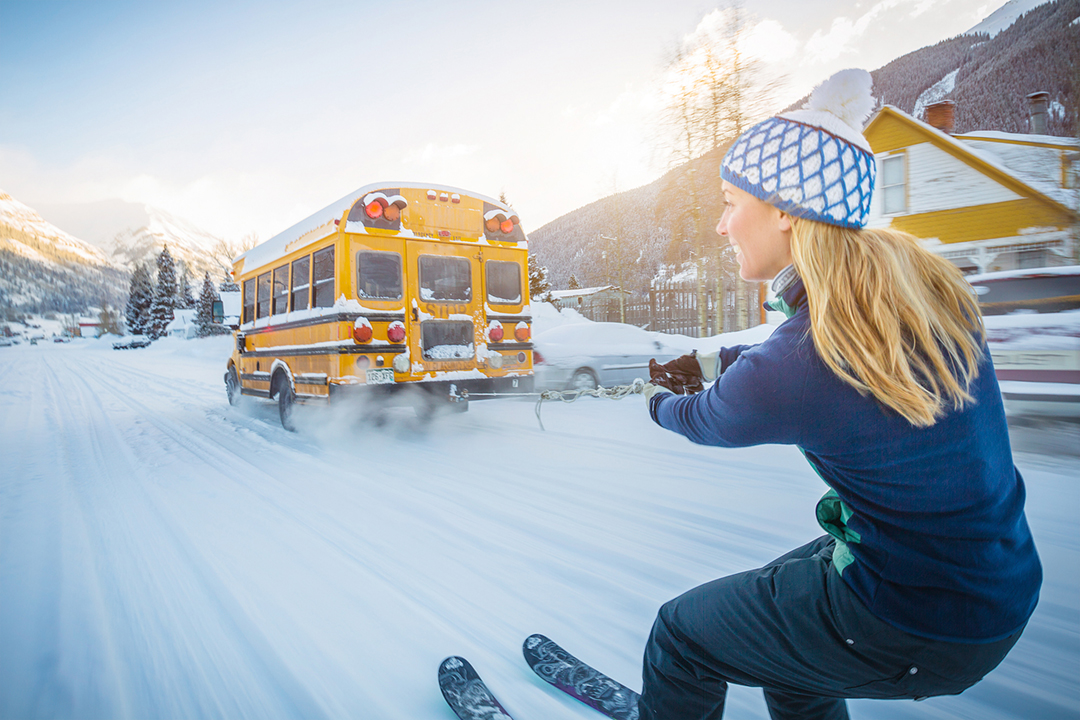 Woman Skiing Behind A Bus In Silverton For Smartwool.