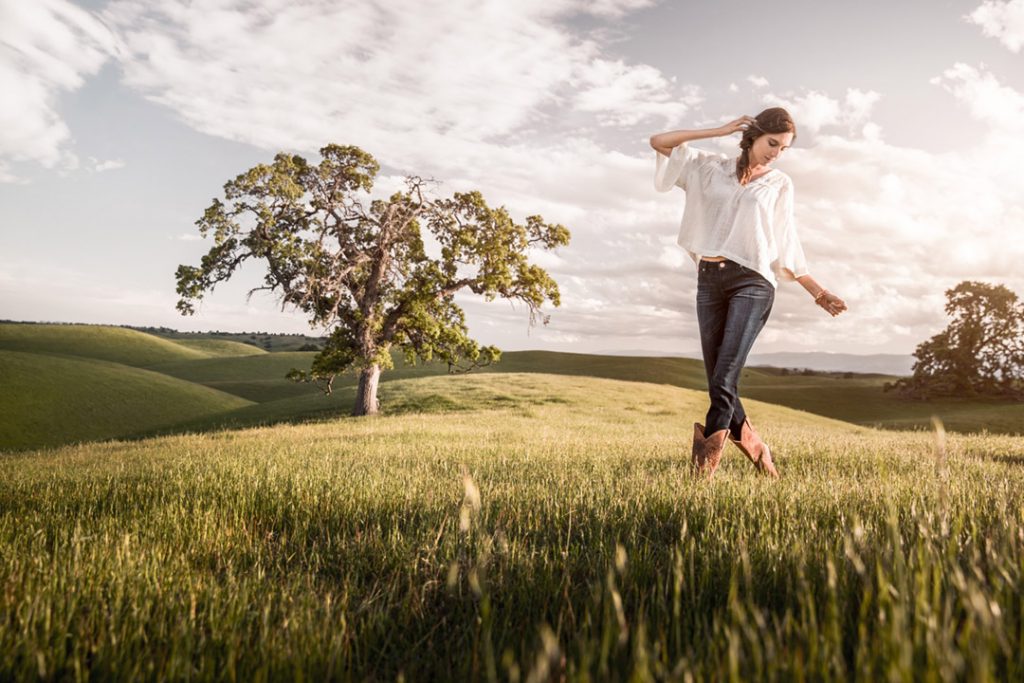 Woman in A Field Wearing Wrangler Jeans For A Sunset Shoot.