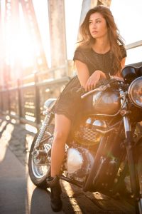 Female motorcycle rider in urban scene at sunset for fashion shoot with EOS R