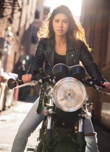 Sexy model on vintage motorcycle in urban setting for high end fashion shoot with EOS R camera