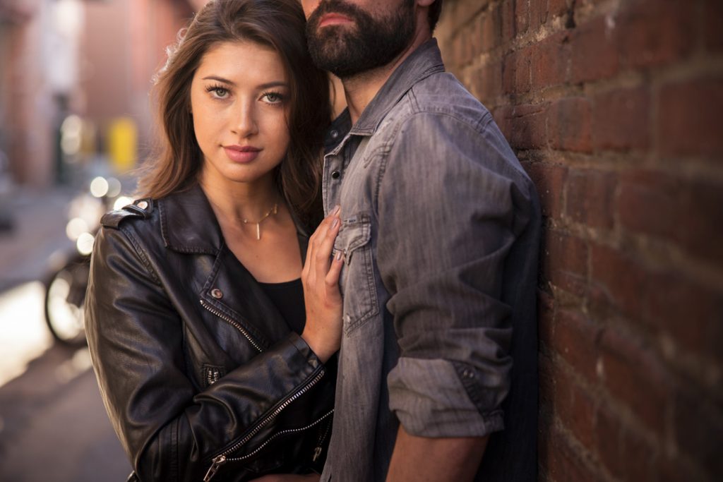 Sexy couple in urban scene for motorcycle fashion shoot in Denver Colorado.