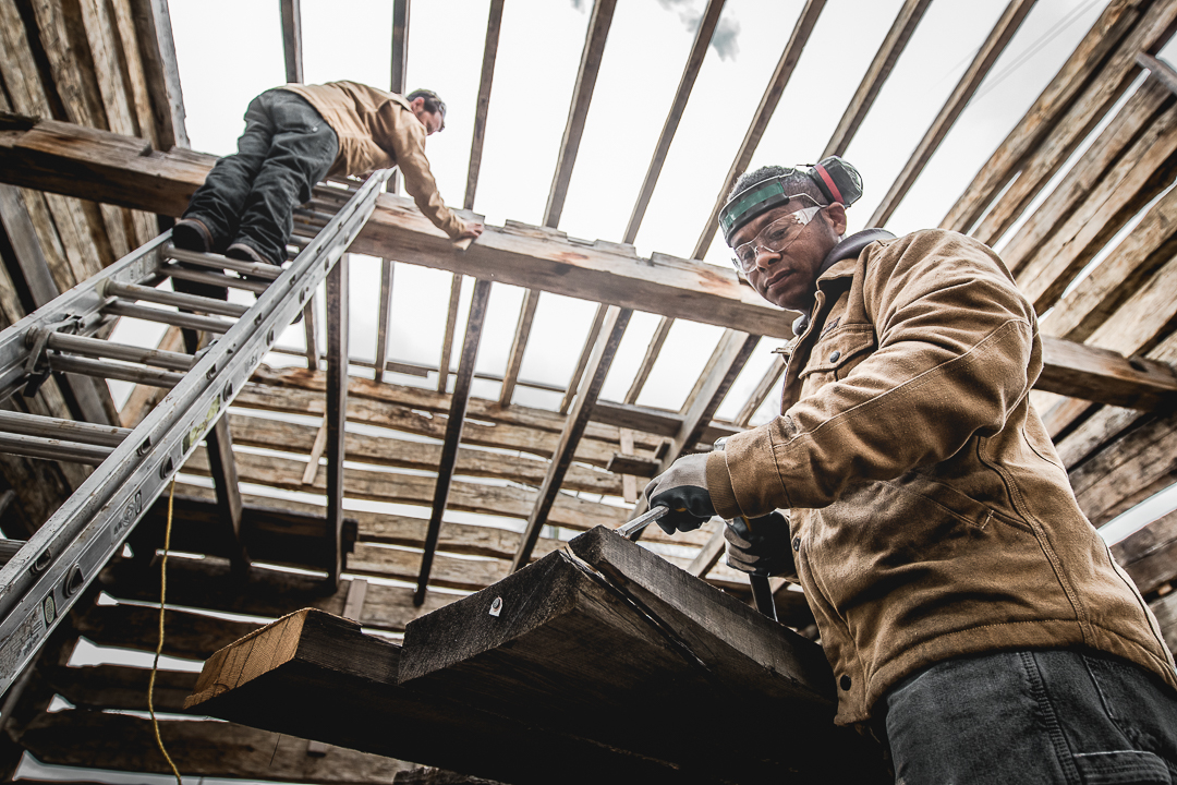 craftsmen reclaimed timber lumber yard for Patagonia. 