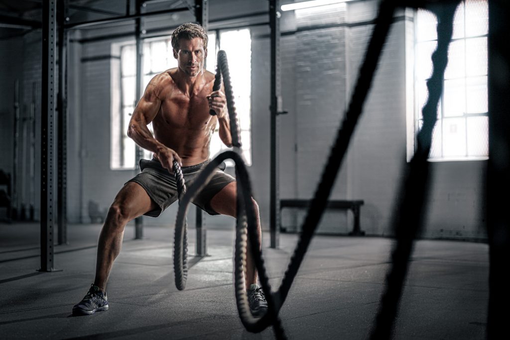 Athlete Chad Pinther works out in his Denver gym.