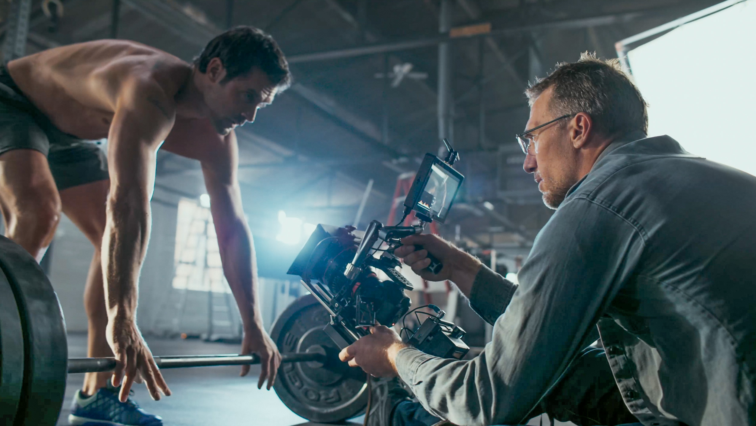 Tyler Stableford films athlete Chad Pinther weight lifting